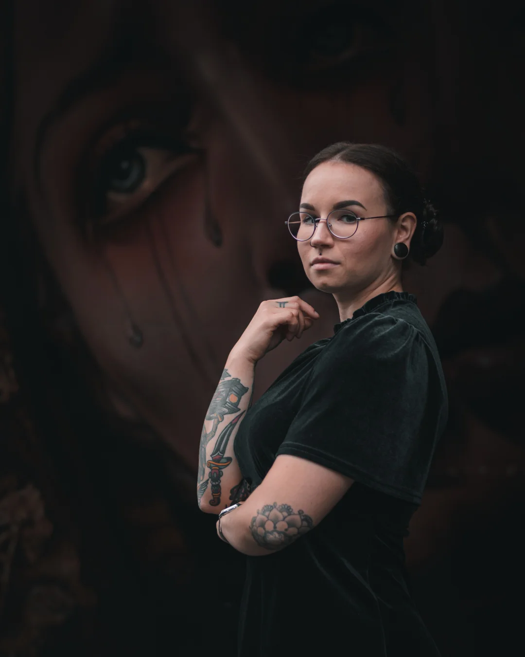 tattooed portrait by mural